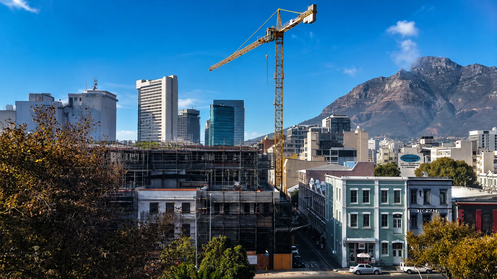Cape Town cityscape with Table Mountain and a construction crane